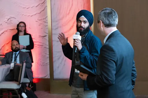 Gulati (middle) speaks at the Project Liberty Summit in 2024